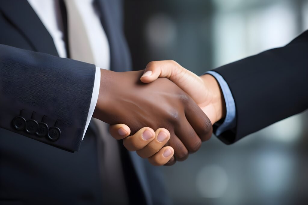 vecteezy_two-business-people-shaking-hands-in-an-office-generative-ai_30763154